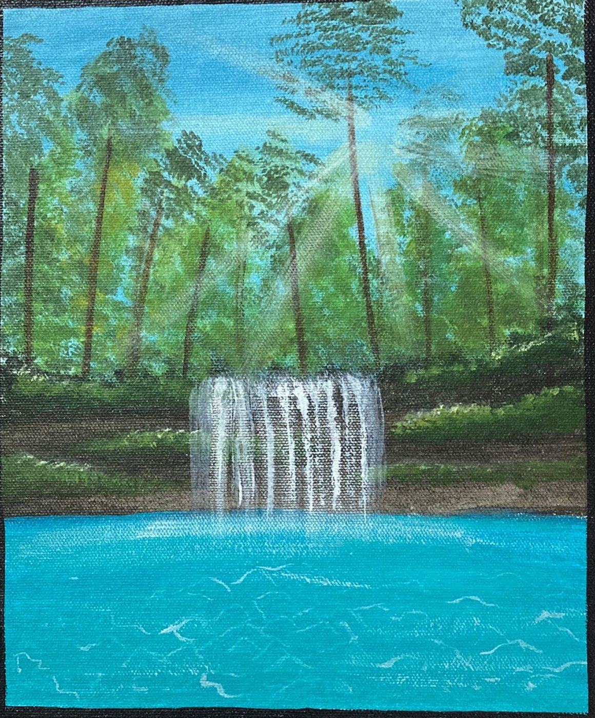 Sunbeams cut through tall forest pines onto a white waterfall spilling into a bright turquoise pool.